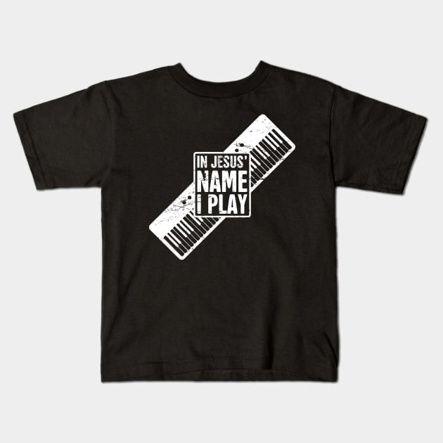 In Jesus Name I Play | Christian Musican Keyboard Player Kids T-Shirt by MeatMan